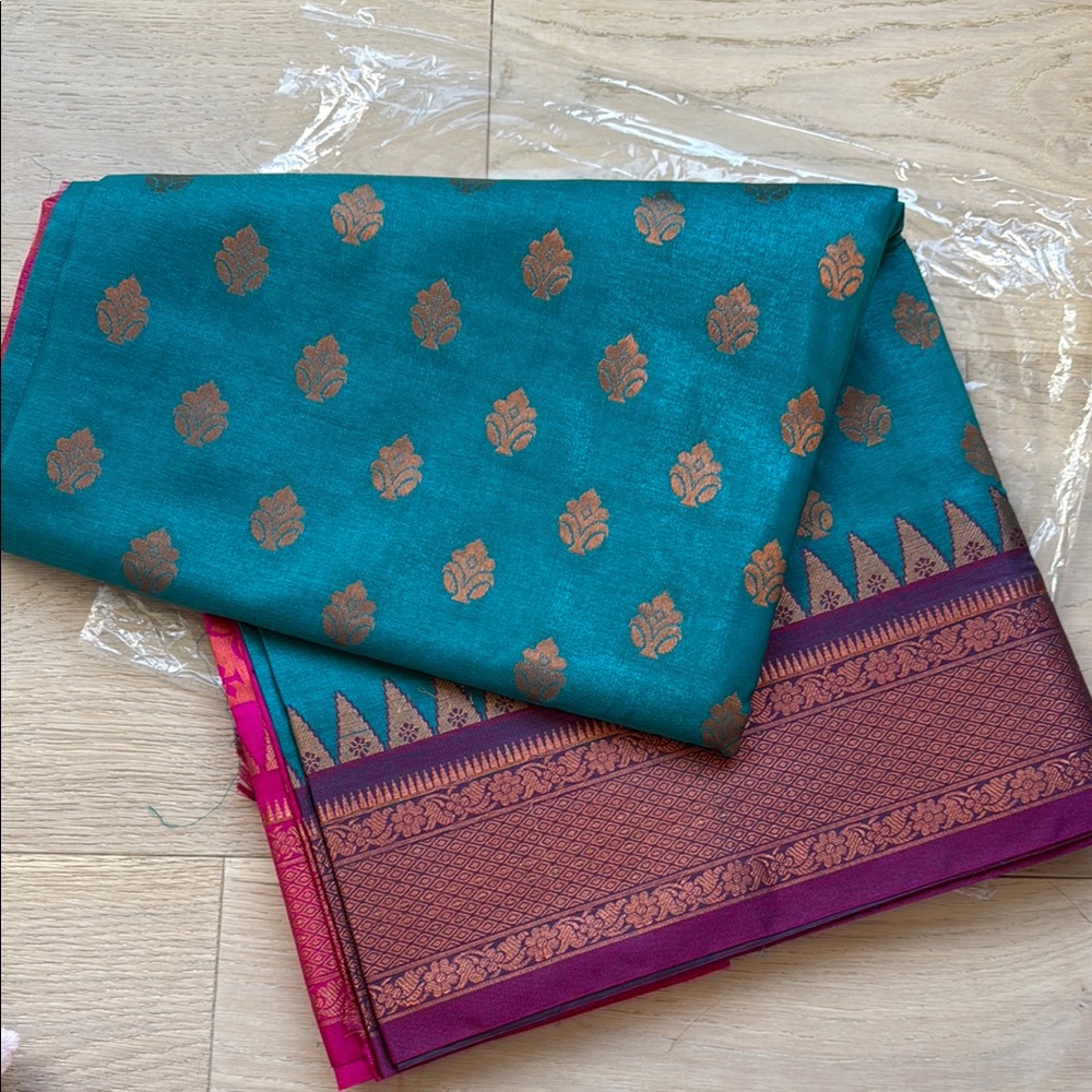 Elegant Teal and Gold silk saree with blouse pieces